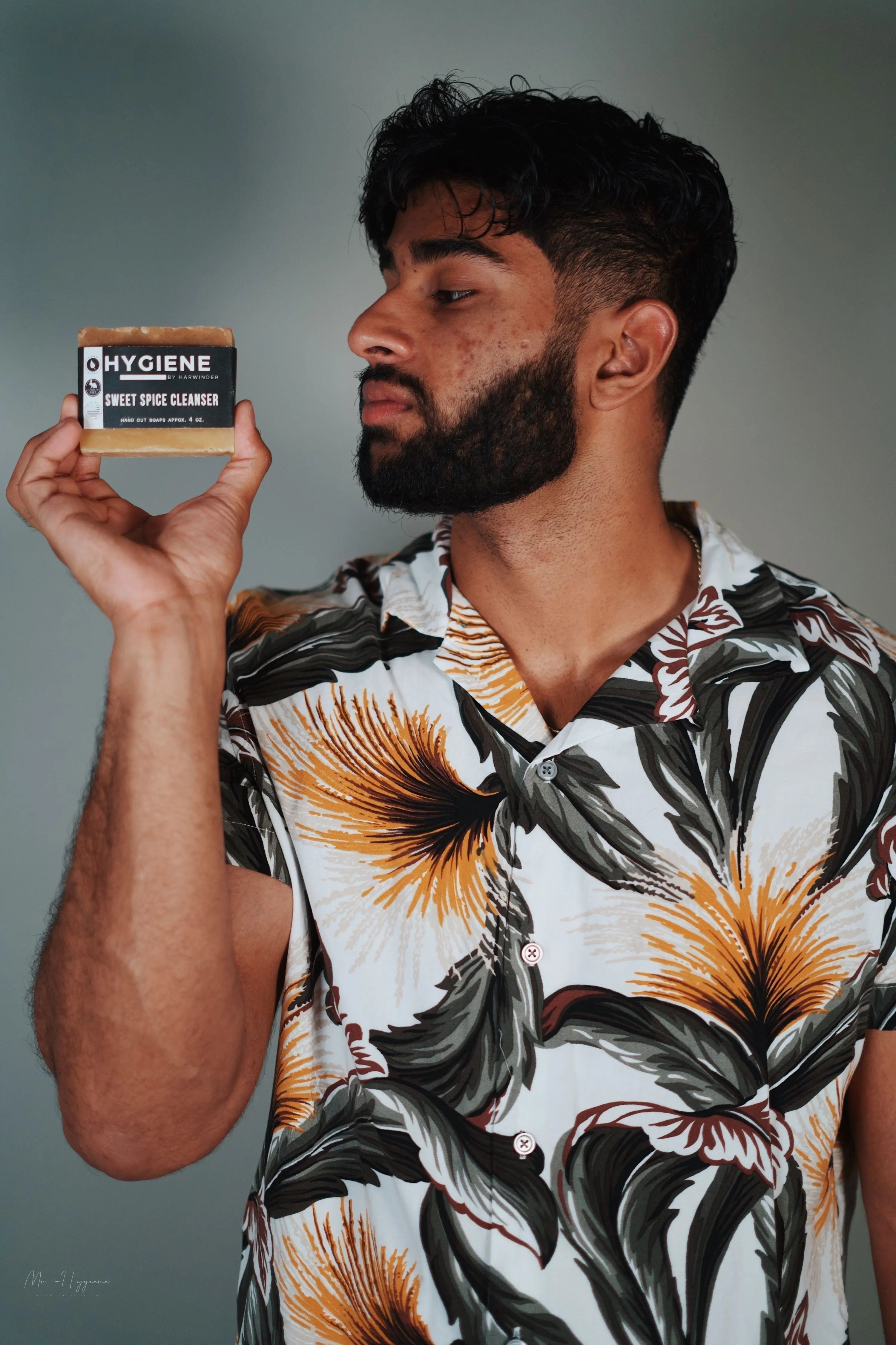 guy holding a bar soap with big nice beard