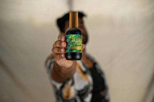 man holding an aftershave bottle