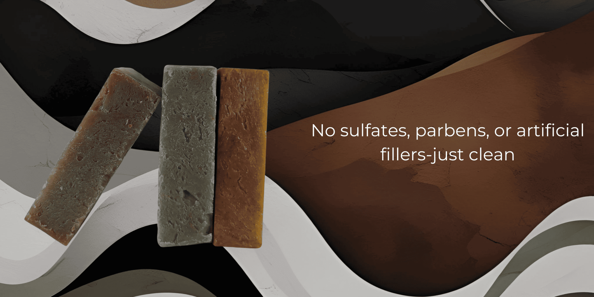 Three bars of soap with a dark background and text about product ingredients.