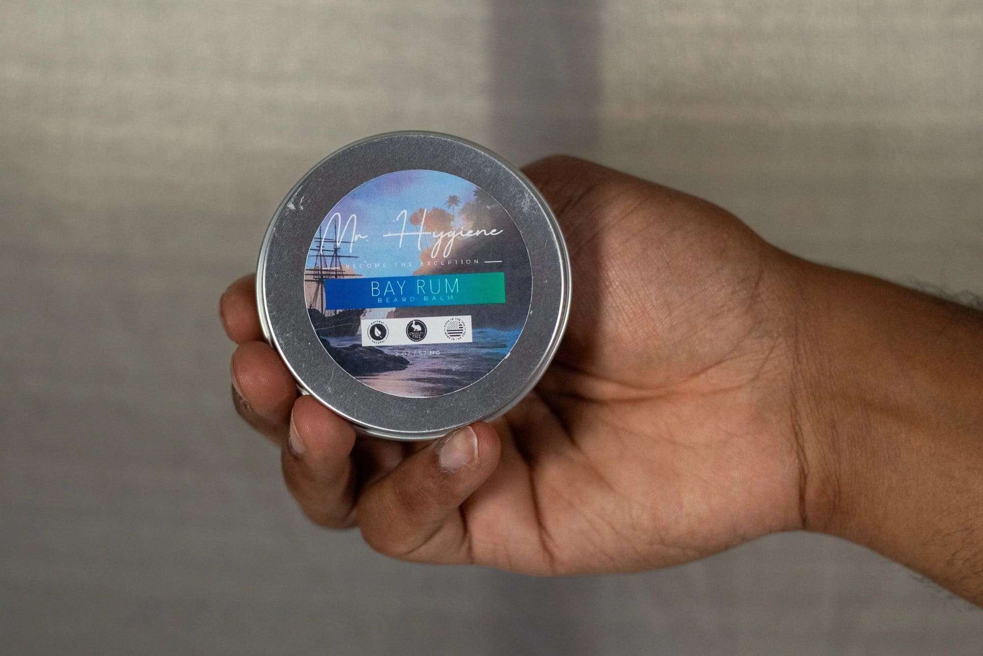 Bay Rum beard balm in hand