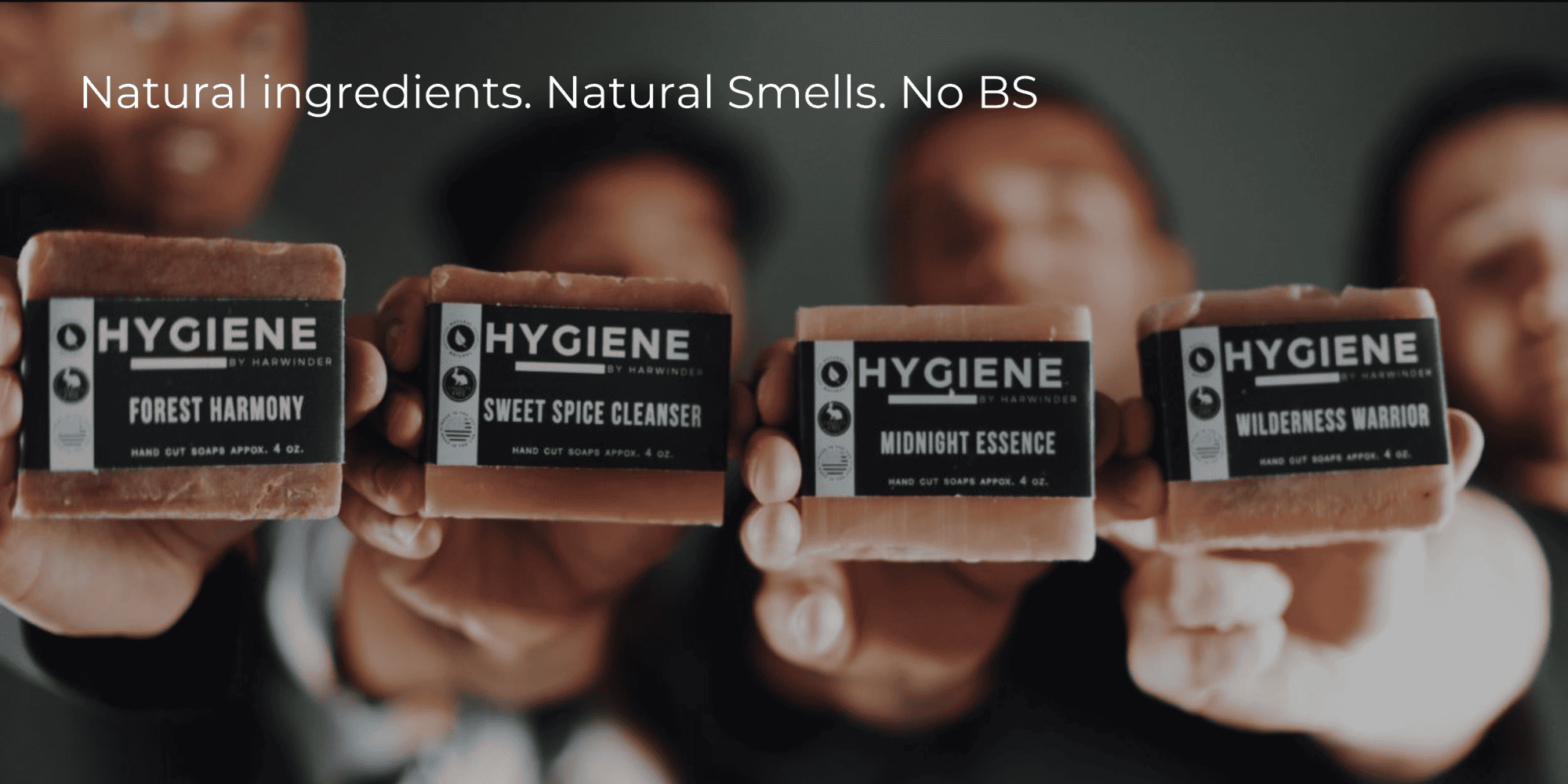 Four guys holding soap bars