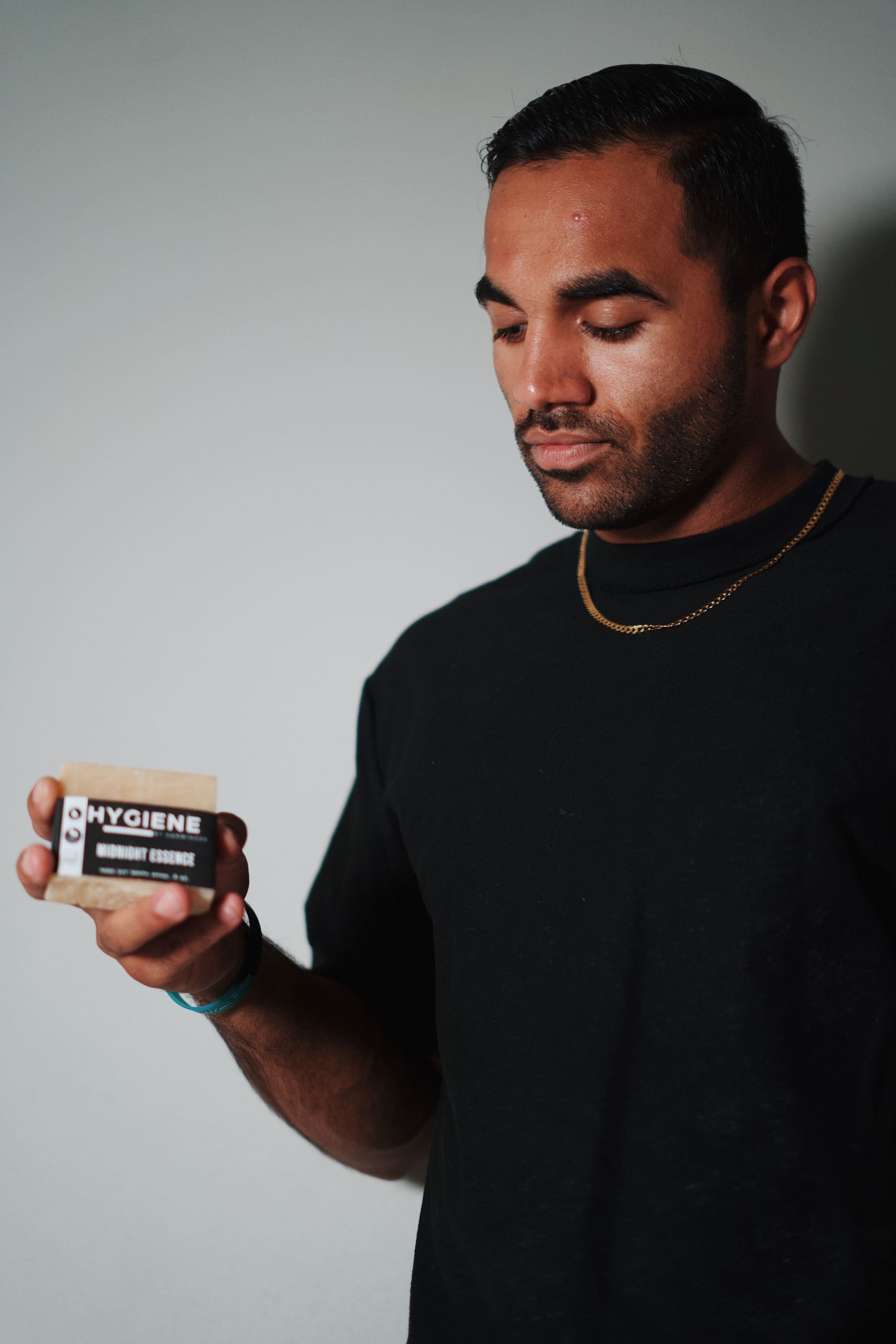 Guy holding a natural bar soap