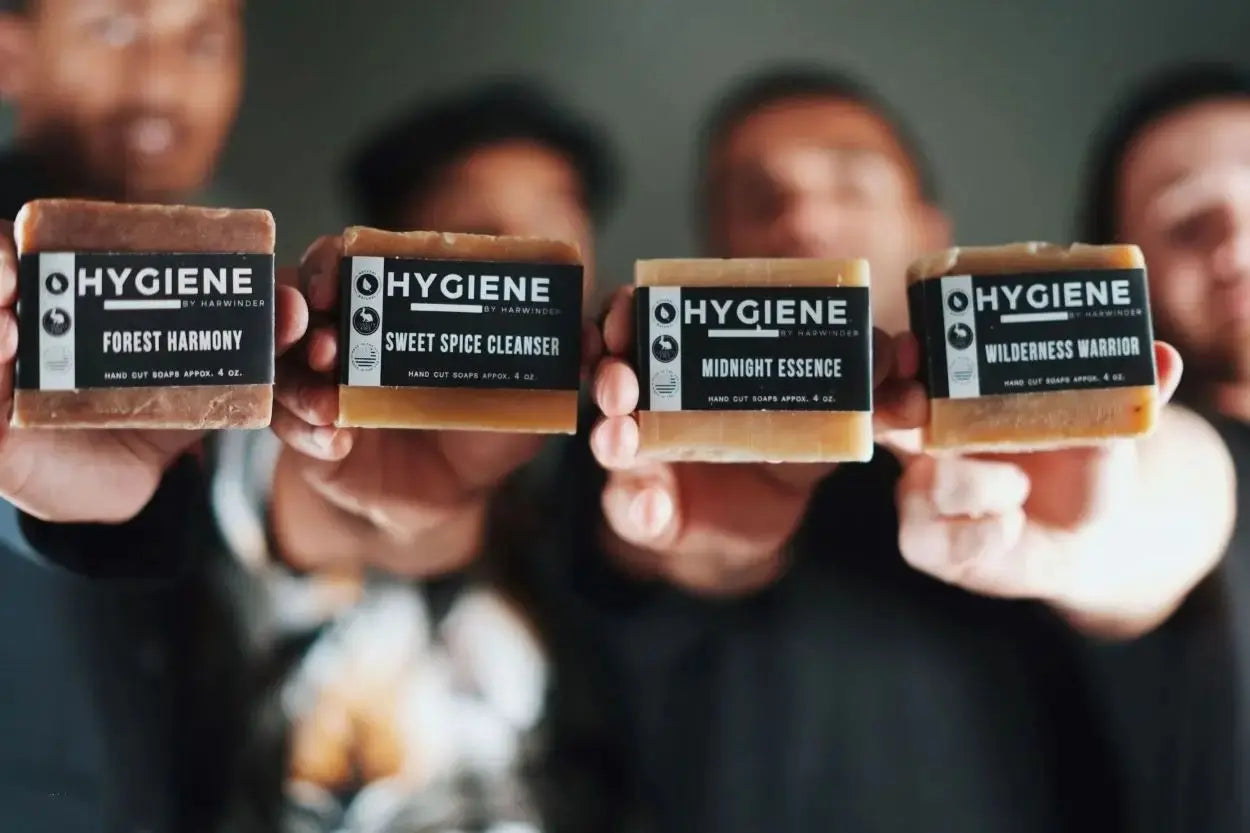 guys holding 4 different bar soaps
