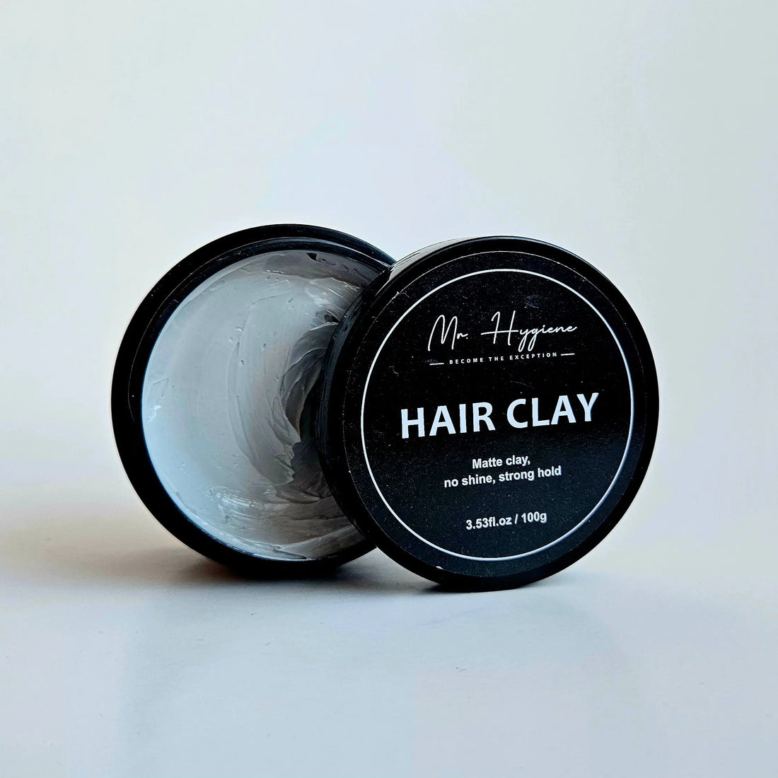 hair clay with opened tin