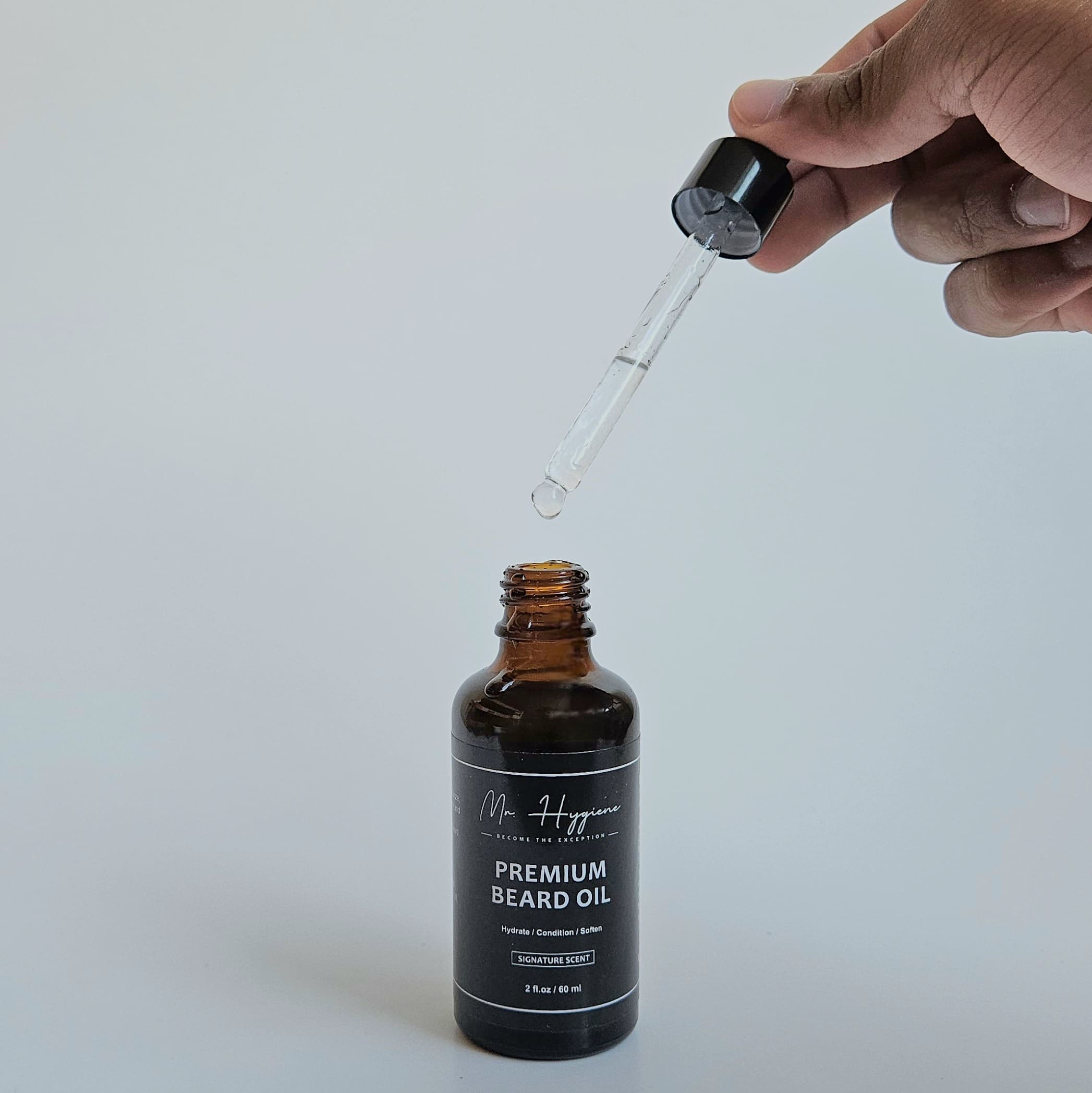 opened beard oil bottle with dropper 