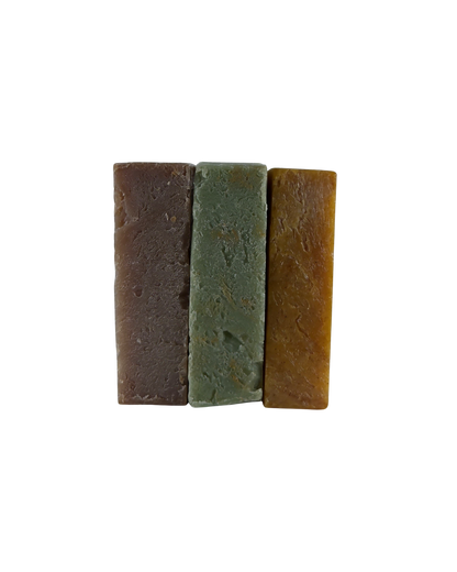Three rectangular soap bars in brown, green, and orange on a white background