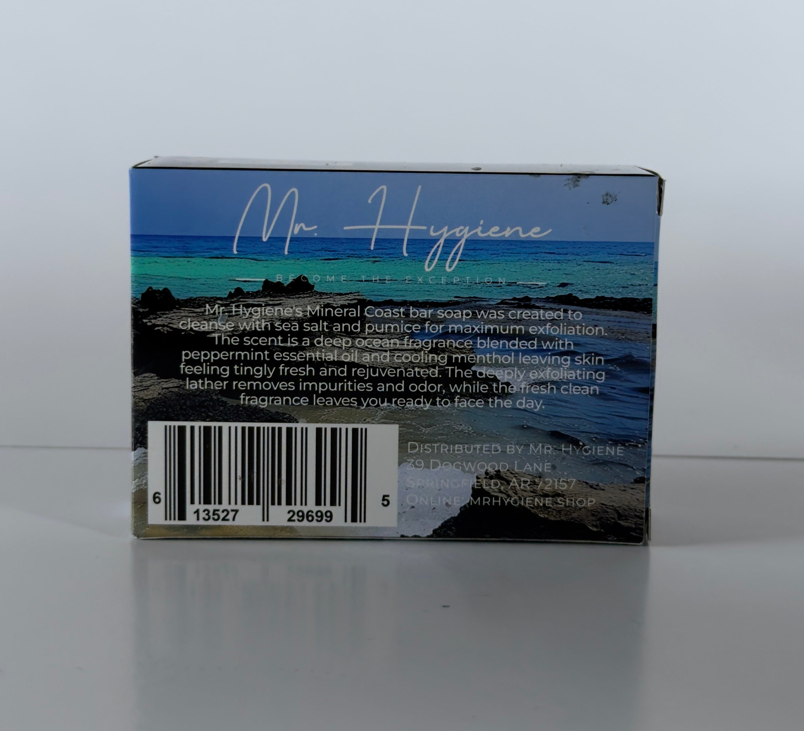 Back of a soap packaging box with scenic design and text on a white background