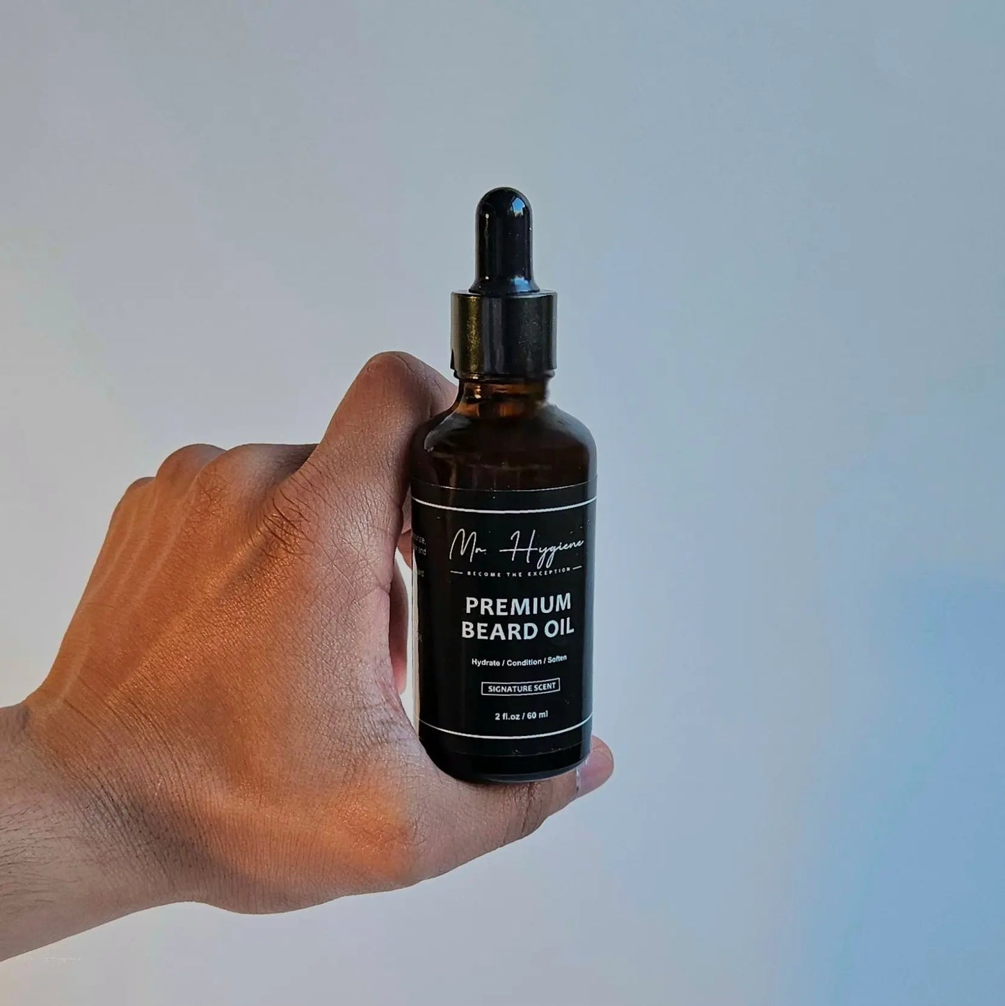 Premium Mens Beard Oil in hand 