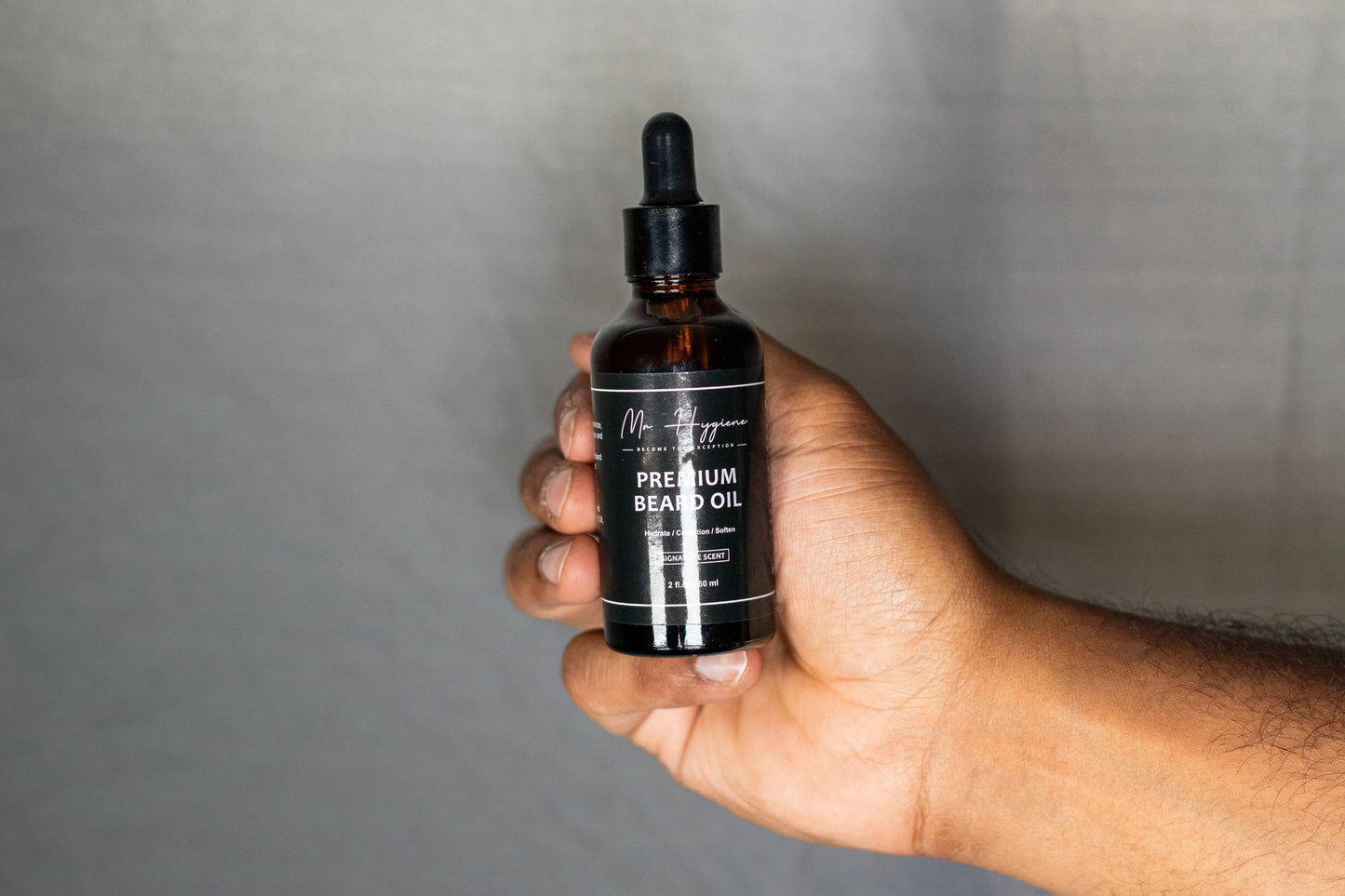 Premium mens beard oil hand shot