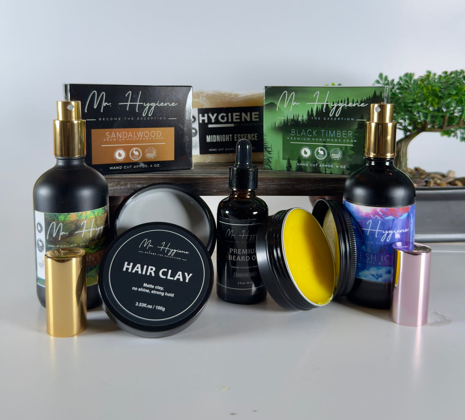 Collection of Mr. Hygiene grooming products on a white surface with a blurred background.