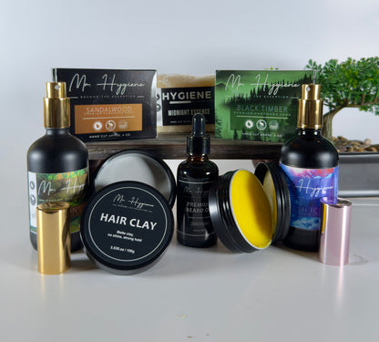 Collection of Mr. Hygiene grooming products on a white surface with a blurred background.