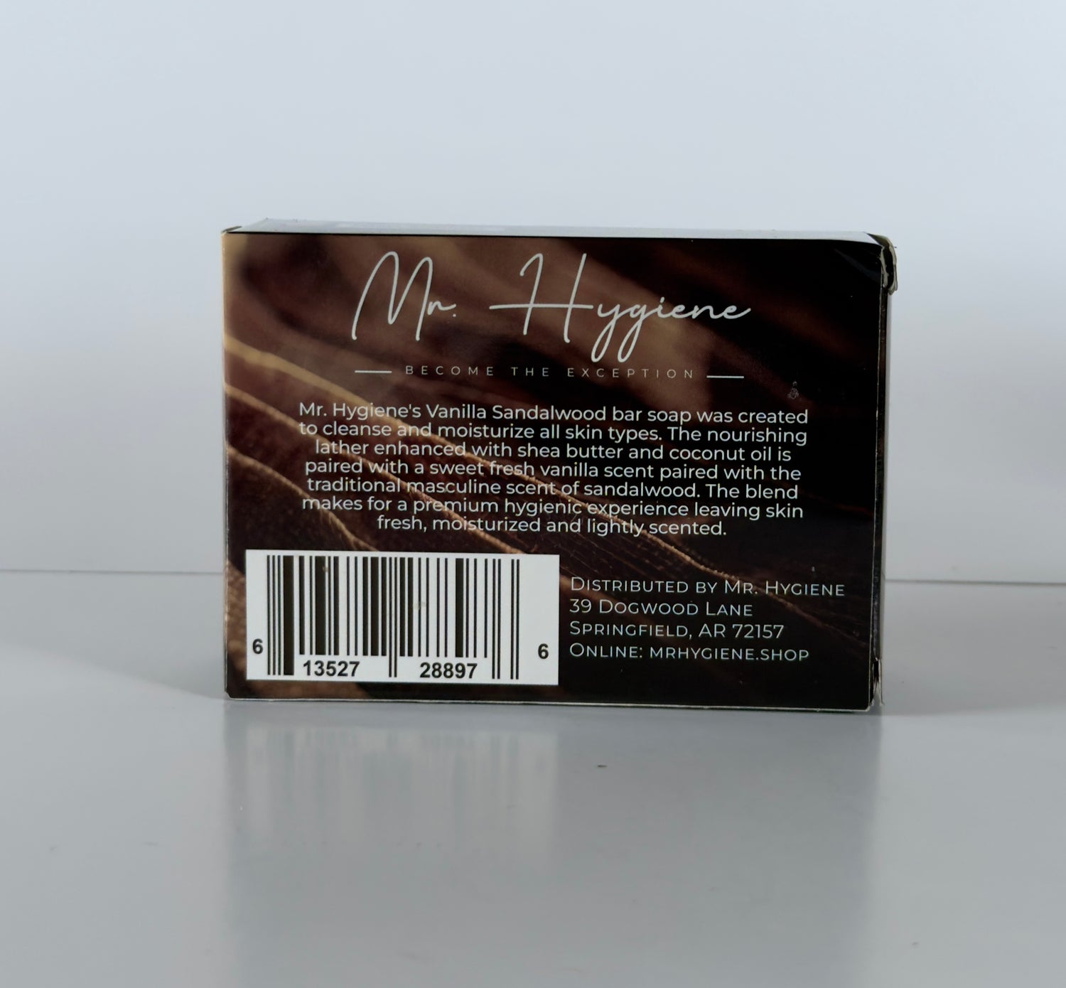 Back of a soap packaging box with text and branding on a white background
